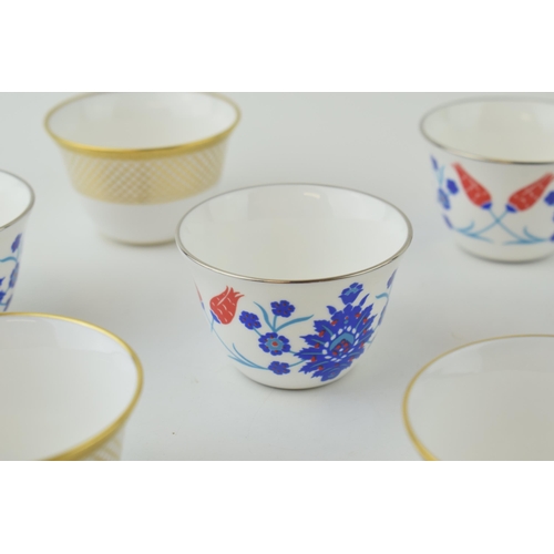 110 - De Lamerie Fine Bone China tea cups to include gold spiral and twist (3) and a floral set (4) (7 in ... 