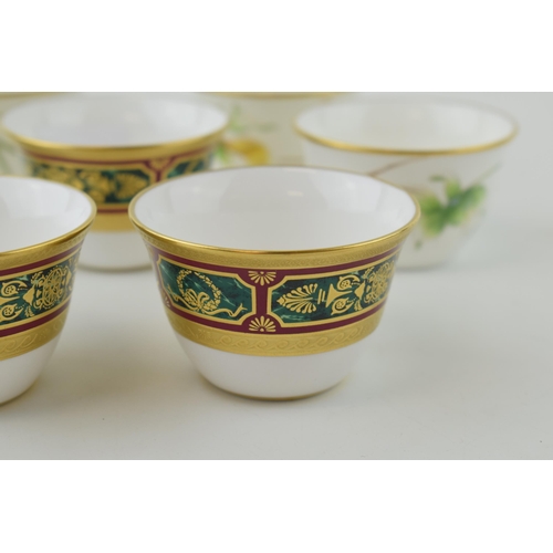 111 - De Lamerie Fine Bone China tea cups to include three with a gilt jewel-work on red and green called ... 