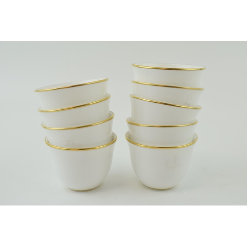 112 - De Lamerie Fine Bone China set of 9 tea cups with plain design with gilded rim (9), 7cm diameter.