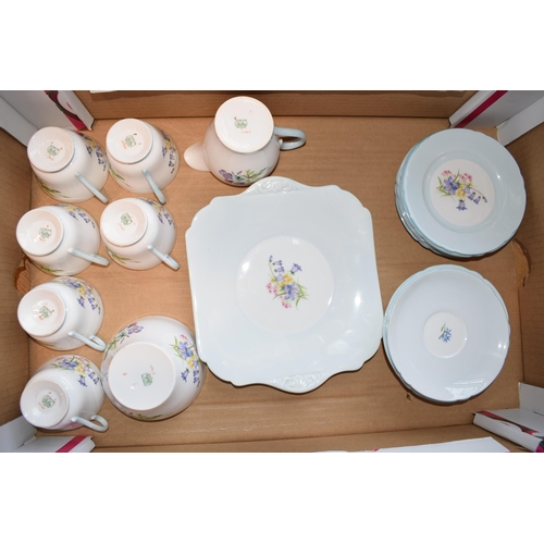 123 - Shelley tea service in the Bluebells pattern 13746 to include six trios, sandwich plate sugar and cr... 