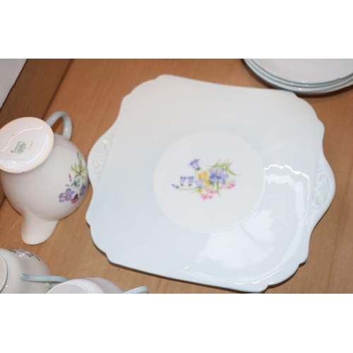 123 - Shelley tea service in the Bluebells pattern 13746 to include six trios, sandwich plate sugar and cr... 