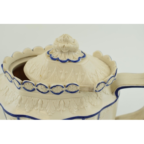 141 - Early 19th century Feldspathic teapot with sliding lid, traditional relief scenes (with damages), wi... 