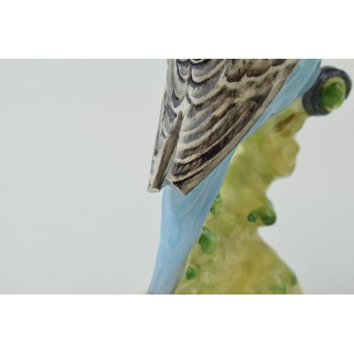 150 - A pair of Beswick Blue Budgerigars / Budgies, both 1217, both with damages (2).