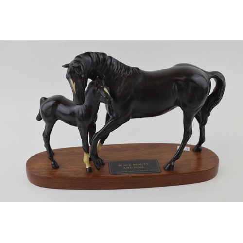 158 - Beswick Black Beauty and Foal on wooden base.