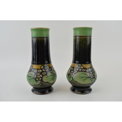 188 - A pair of Royal Doulton stoneware vases, low shouldered, with matte decoration with green gloss glaz... 