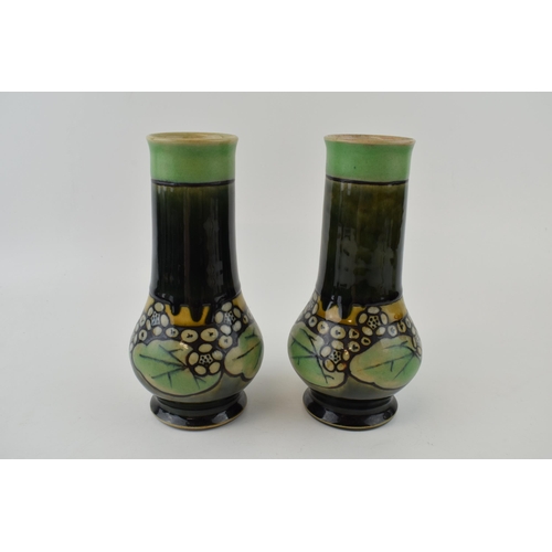 188 - A pair of Royal Doulton stoneware vases, low shouldered, with matte decoration with green gloss glaz... 