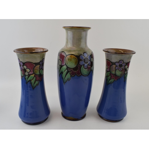 193 - A pair of Royal Doulton vases with Art Deco design, fruit and flowers, with a matched vase, tallest ... 