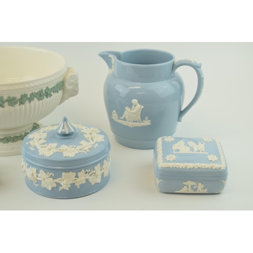 256 - A collection of Wedgwood Embossed Queensware items, to include jug, height 16cm. A lidded circular p... 