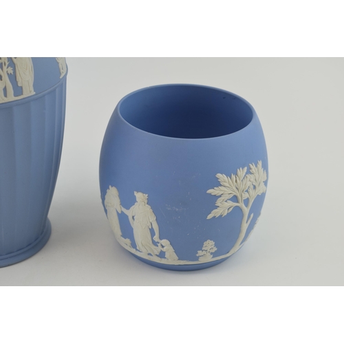 269 - Wedgwood Jasperware in blue to include a large ribbed vase, 25cm tall, with a near pair of bulbous v... 