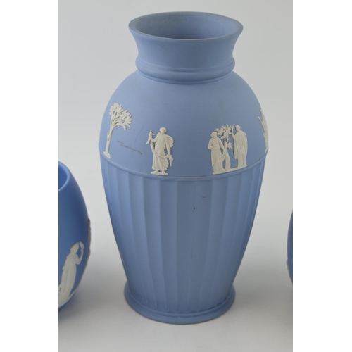 269 - Wedgwood Jasperware in blue to include a large ribbed vase, 25cm tall, with a near pair of bulbous v... 