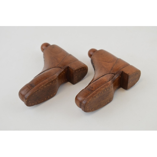 291 - A pair of miniature treen boots with hobnail soles and fine detail to laces. Height 7.5cm.