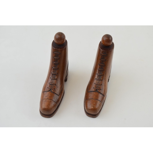 291 - A pair of miniature treen boots with hobnail soles and fine detail to laces. Height 7.5cm.