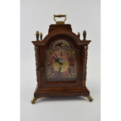 86 - Wuba Warmink mahogany and similar cased mantel clock with metal roman numeral dial, supported on bra... 