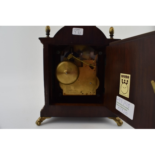 86 - Wuba Warmink mahogany and similar cased mantel clock with metal roman numeral dial, supported on bra... 