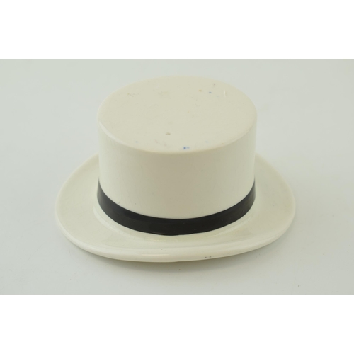 94 - F R Tripler & Co pottery top hat in white and black colours, 10.5cm long.