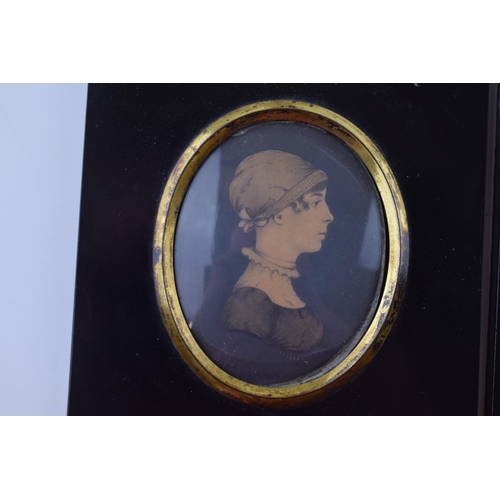 614 - A pair of framed miniatures, oval mounts, of a man and a lady, 13.5cm tall inc frames (2).