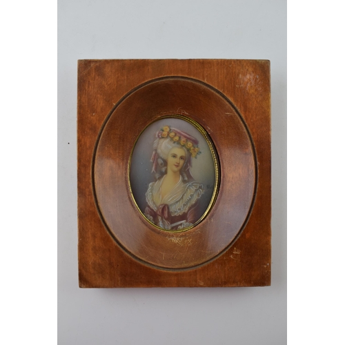 616 - A framed portrait of a lady in traditional dress, wooden frame, 16cm tall.