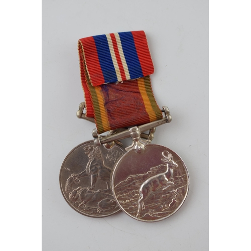 624 - A pair of World War Two medals to include an Africa service medal and 1939-1945 medal, W587148 T M A... 