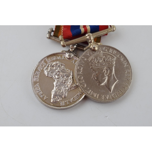 624 - A pair of World War Two medals to include an Africa service medal and 1939-1945 medal, W587148 T M A... 