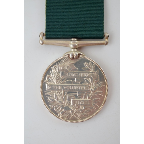 627 - Victorian silver medal 'For Long Service in the Volunteer Force', with ribbon, unnamed.