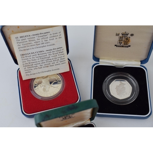 629 - Four cased sterling silver proof coins to include Piedfort Twenty Pence, a 50p, a pound coin and a c... 