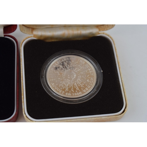 631 - Two cased silver proof crowns (2), each weighing 28g.