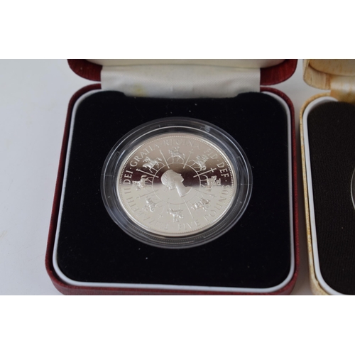 631 - Two cased silver proof crowns (2), each weighing 28g.