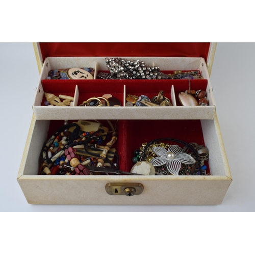 634 - A jewellery box containing a quantity of costume jewellery such as brooches, rings, necklaces and ot... 