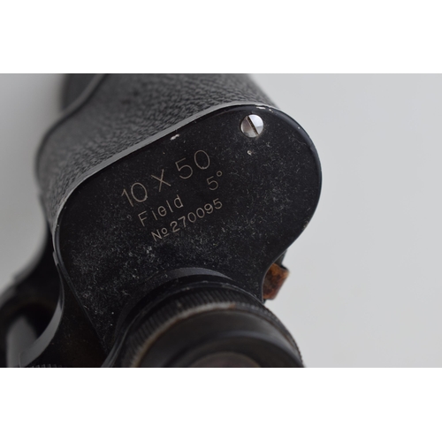 322 - A pair of Zuiho 10 x 50 coated lens binoculars with an early 20th century cast brass kandil lamp / b... 