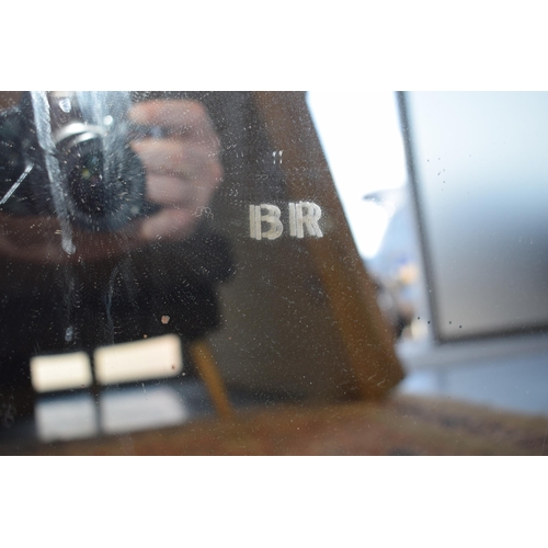 327 - British Railway mirror marked 'BR' in the centre. Four holes for wall mounting.  42cm x 52cm.