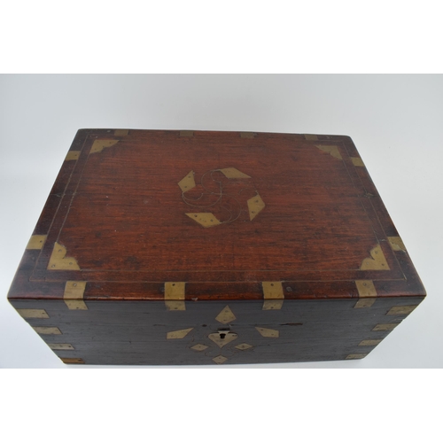 445 - Late 19th century wooden and brass bound travelling chest, with fitted interior and mirror, brass es... 