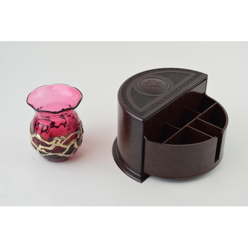 450 - A vintage Bakelite cigarette box , demi-lune form, 16cm wide, with a cranberry glass vase with overl... 