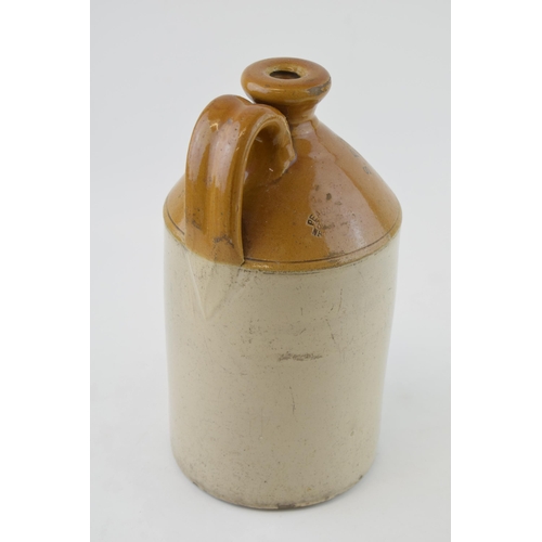 452 - A vintage stoneware flagon 'S.F. JONES & SONS' Manchester 1930. By Pearson & Co. Height 28cm.