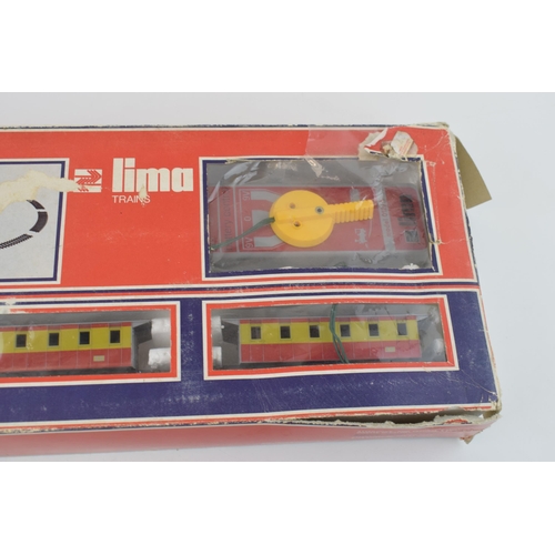 461 - Boxed vintage Lima Trains 1970s train set basic layout with engine, carriages, track and controller.