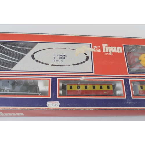 461 - Boxed vintage Lima Trains 1970s train set basic layout with engine, carriages, track and controller.