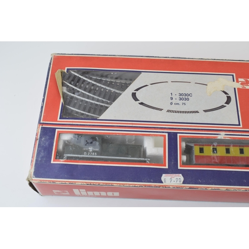 461 - Boxed vintage Lima Trains 1970s train set basic layout with engine, carriages, track and controller.