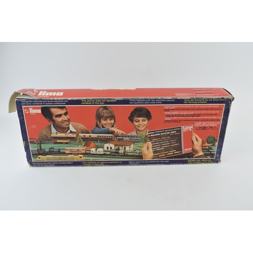 461 - Boxed vintage Lima Trains 1970s train set basic layout with engine, carriages, track and controller.