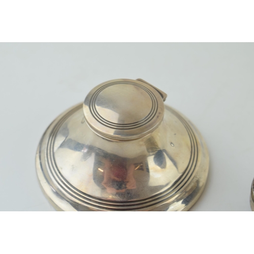 580 - Silver inkwell with glass liner, Birmingham 1931, with a silver raised miniature jewellery casket, o... 