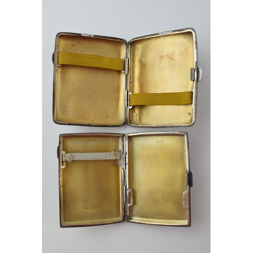 583 - A pair of silver cigarette cases, with striped decoration, 122.4g (2 - with dents).