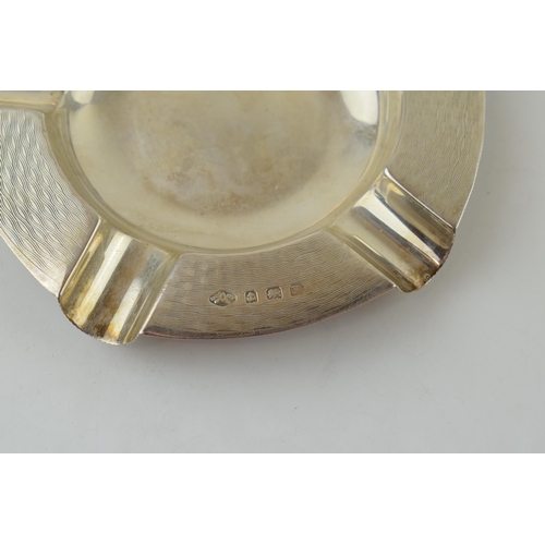 584 - A pair of silver ashtrays, engineered design, Birmingham 1933, 11.5cm wide, with a similar singular ... 