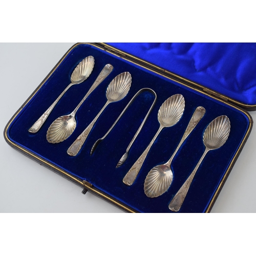 593 - Silver set of six tea spoons with matching tongs, bright cut decoration, in fitted case, London 1890... 