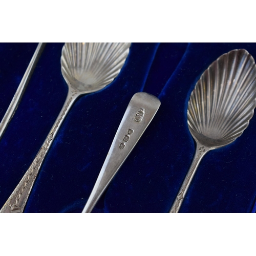 593 - Silver set of six tea spoons with matching tongs, bright cut decoration, in fitted case, London 1890... 