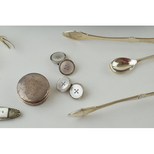 594 - Silver to include a pair of silver and mother of pearl cufflinks, a condiment spoon, a Georgian pair... 