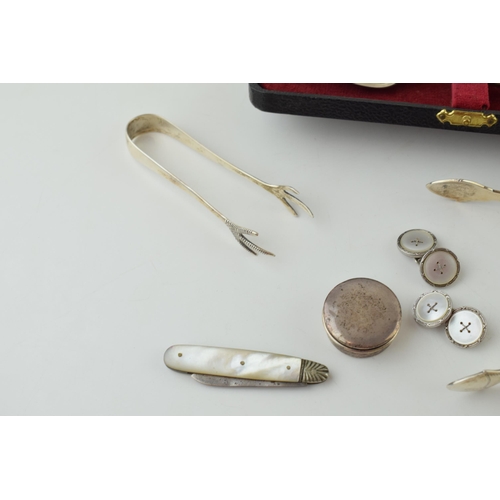 594 - Silver to include a pair of silver and mother of pearl cufflinks, a condiment spoon, a Georgian pair... 