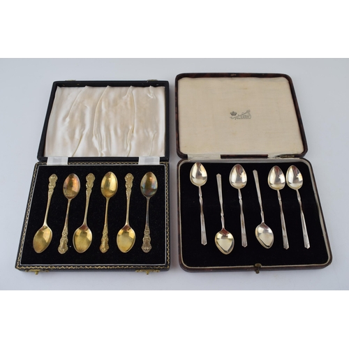 597 - Two cased sets of six silver tea spoons, one gilt set, Birmingham 1957, Henry Clifford Davis, with a... 