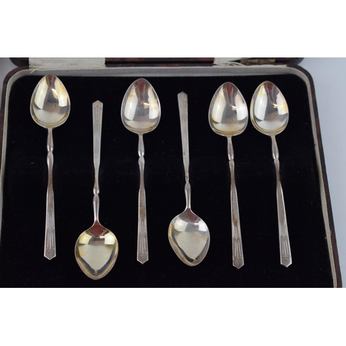 597 - Two cased sets of six silver tea spoons, one gilt set, Birmingham 1957, Henry Clifford Davis, with a... 