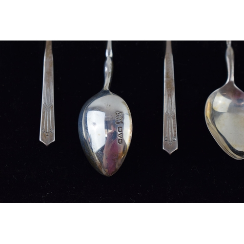 597 - Two cased sets of six silver tea spoons, one gilt set, Birmingham 1957, Henry Clifford Davis, with a... 