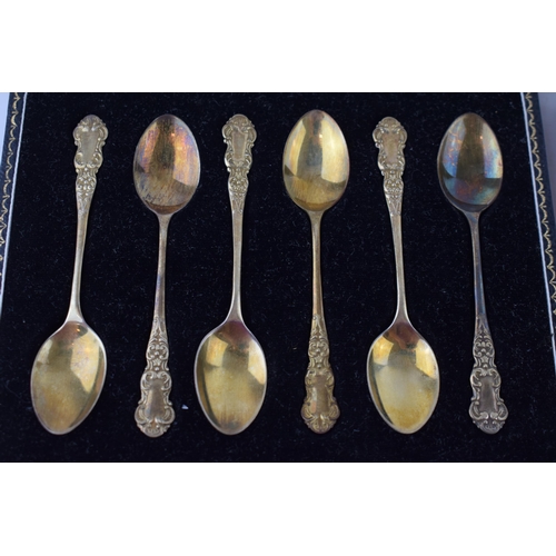 597 - Two cased sets of six silver tea spoons, one gilt set, Birmingham 1957, Henry Clifford Davis, with a... 