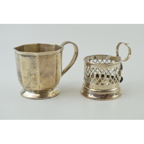 600 - A silver octagonal small tankard, 7cm tall, Birmingham 1928, with a pierced cup holder, Birmingham 1... 