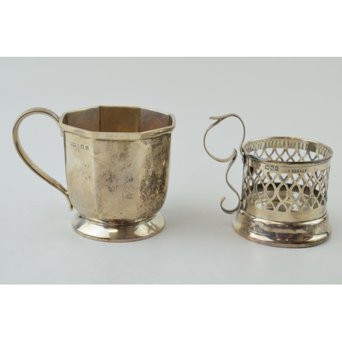 600 - A silver octagonal small tankard, 7cm tall, Birmingham 1928, with a pierced cup holder, Birmingham 1... 